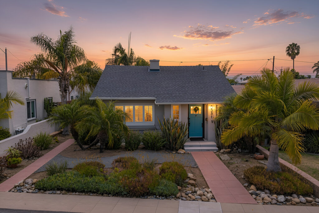 North Park bungalow with light blue door during evening setset